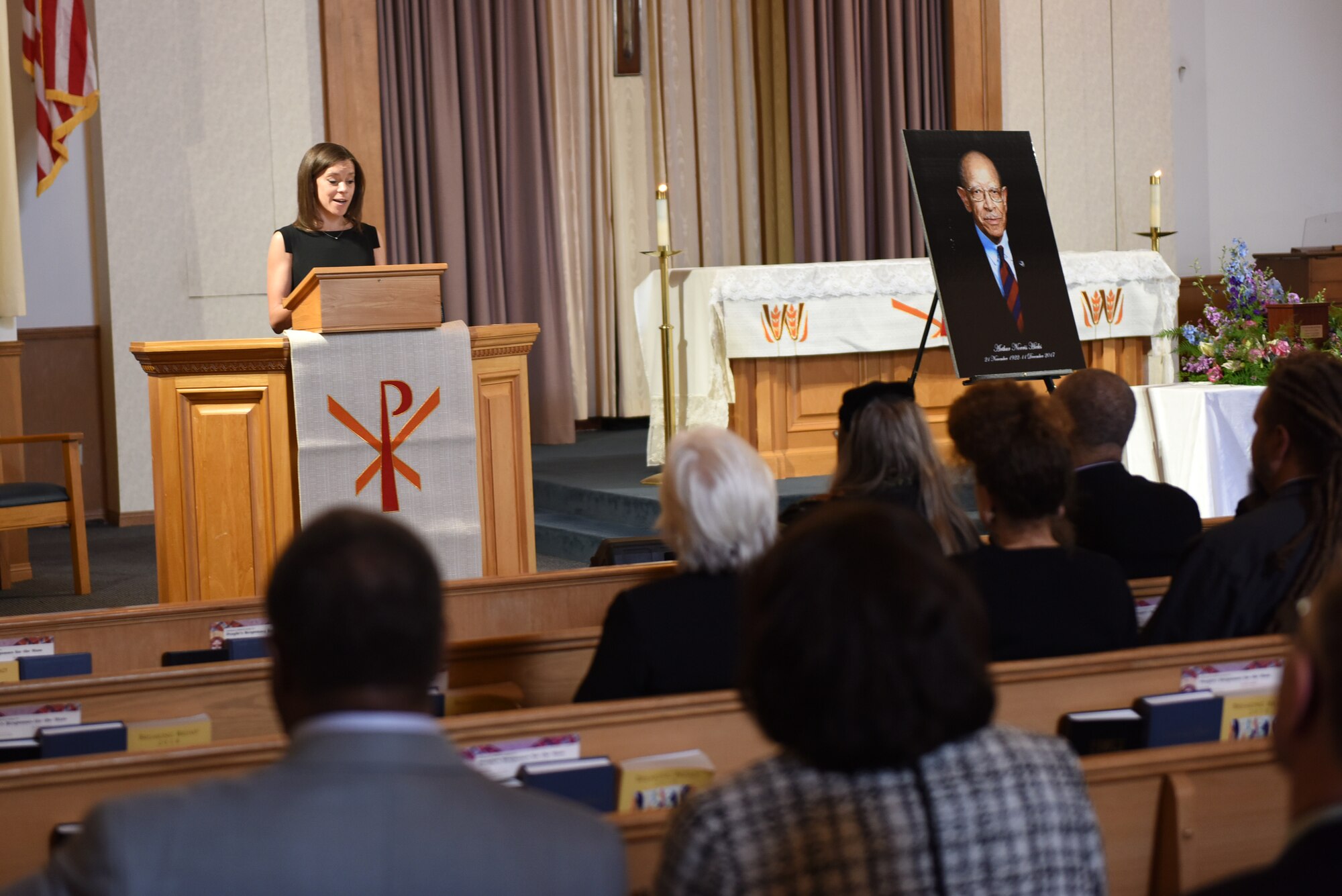 Michelle Hicks Behrens, granddaughter of Chief Master Sgt. Arthur Norris Hicks, speaks during Hicks’ memorial service at the base chapel, March 17, 2018, Vandenberg Air Force Base, Calif. Hicks served with the Tuskegee Airmen during World War II and worked as an educator and human rights advocate. (U.S. Air Force photo by Tech. Sgt. Jim Araos/Released)