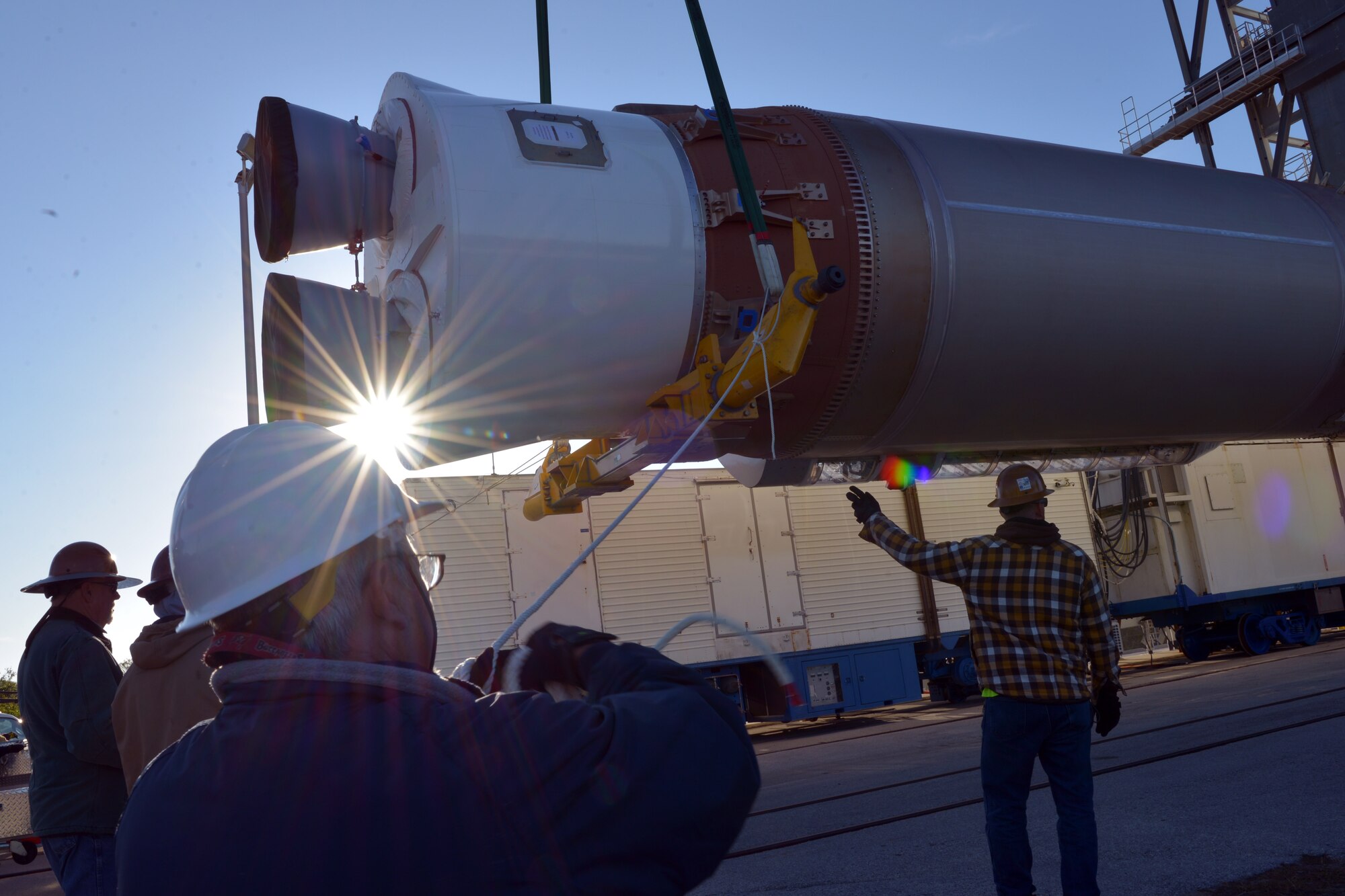 United Launch Alliance employees work to raise and secure an Atlas V booster at the United Launch Alliance Vertical Integration Facility, located on Cape Canaveral Air Force Station, Fla.,  March 13. (U.S. Air Force photo by Airman Zoe Thacker)