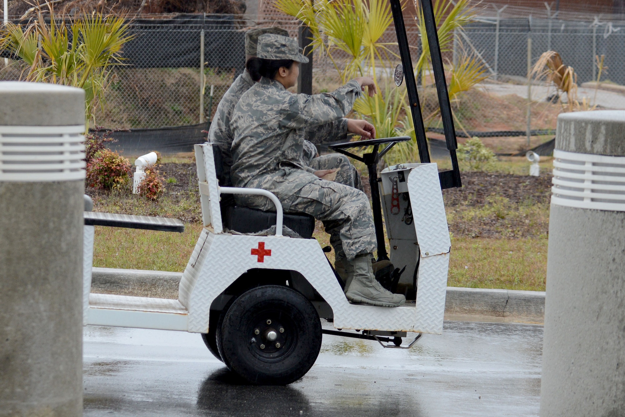 U.S. Air Force Tech. Sgt. Brian Londo, 20th Medical Group (MDG) medical logistics warehouse noncommissioned officer in charge, drives a Team Shaw Airman to the 20th MDG staff parking lot using the patient shuttle golf cart at Shaw Air Force Base, S.C., March 19, 2018.