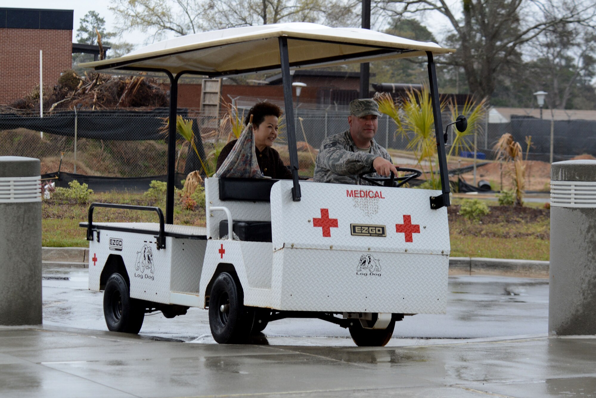 U.S. Air Force Tech. Sgt. Brian Londo, 20th Medical Group (MDG) medical logistics warehouse noncommissioned officer in charge, drives a Team Shaw member to the 20th MDG clinic using the patient shuttle golf cart at Shaw Air Force Base, S.C., March 19, 2018.