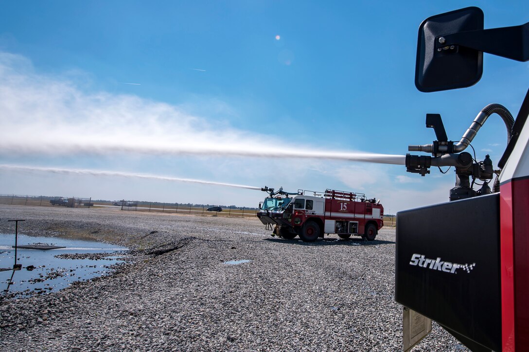 Water shoots from the hoses of Aircraft rescue firefighting vehicles during a live-fire burn exercise, March 16, 2018, at Moody Air Force Base, Ga. Firefighters from the 23d CES conducted the exercise to demonstrate their firefighting capabilities to community leaders and Moody’s honorary commanders.(U.S. Air Force photo by Airman Eugene Oliver)