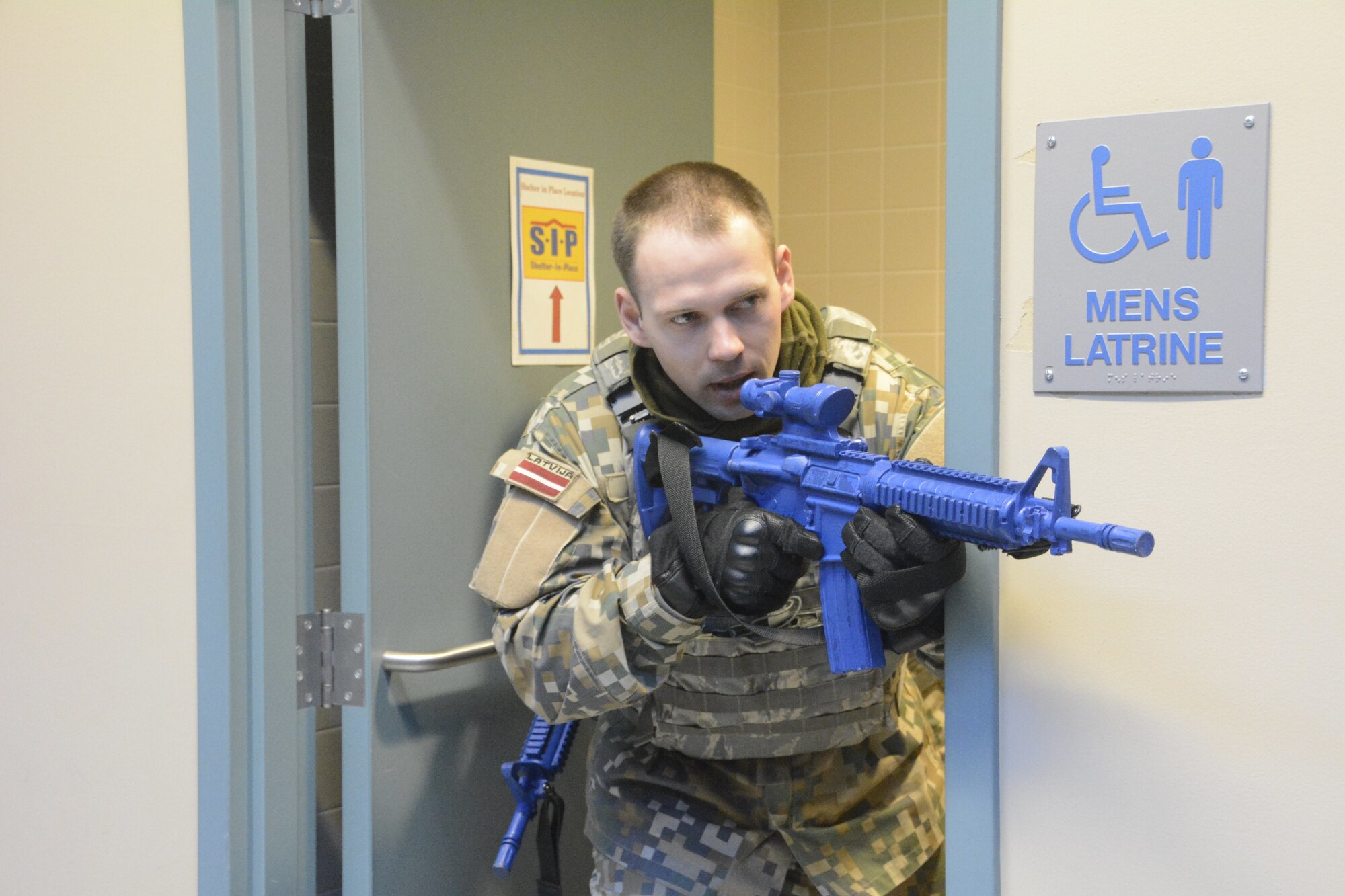 Active shooter tactics familiarization event between the Michigan Air National Guard, military personnel from the Republic of Latvia, and a local Michigan police force was held on March 16, 2018, facilitated by the 110th Attack Wing Security Forces Squadron, Battle Creek Air National Guard Base, Mich. (U.S. Air National Guard photo/Airman 1st Class Tiffany Clark)