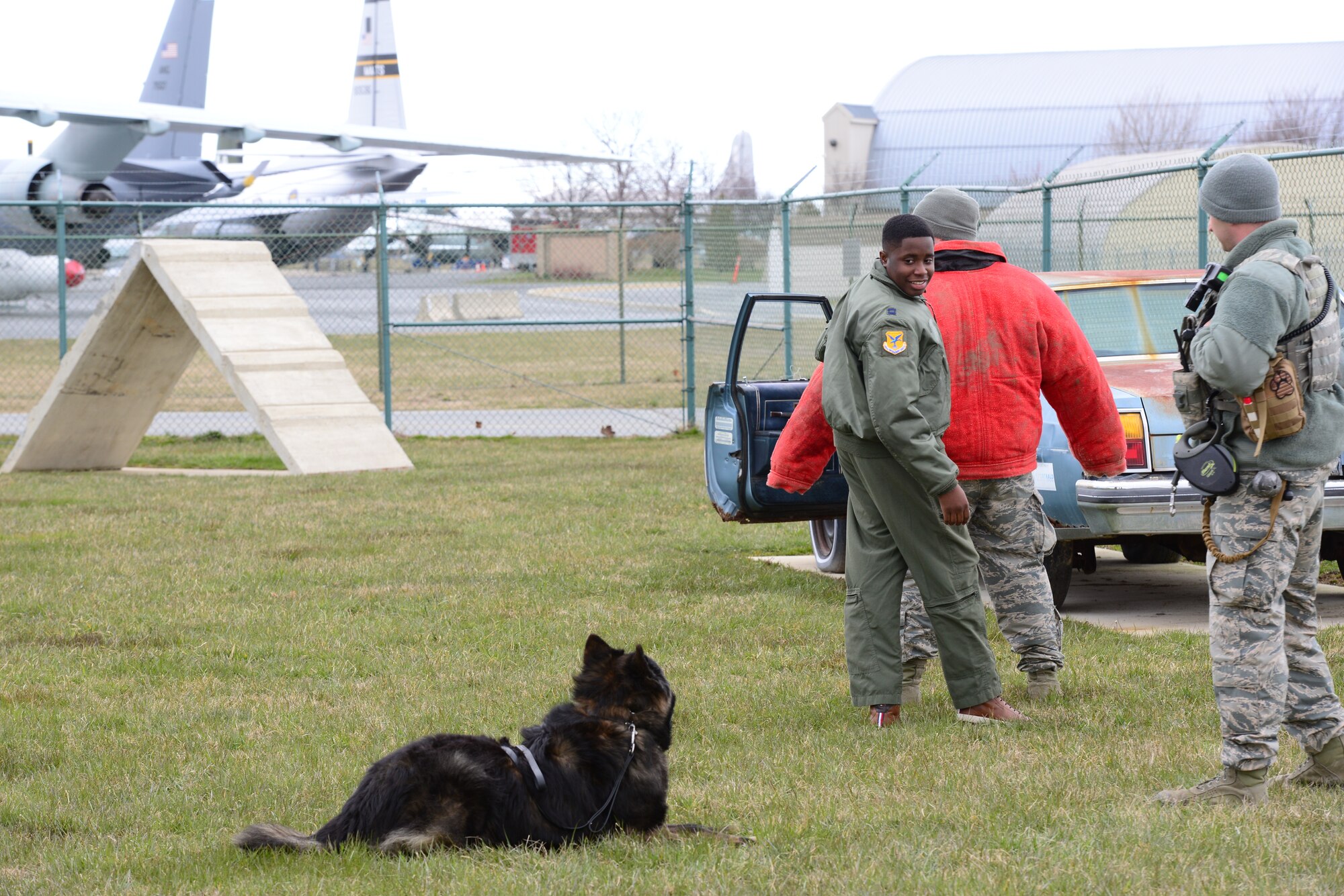 Kareem Bennett searches a suspect during a military working dog demonstration March 16, 2018, at Dover Air Force Base, Del. Bennett, a guest of the 3rd Airlift Squadron, was invited to take part in an all-day personalized tour of the installation. (U.S. Air Force photo by Staff Sgt. Aaron J. Jenne)
