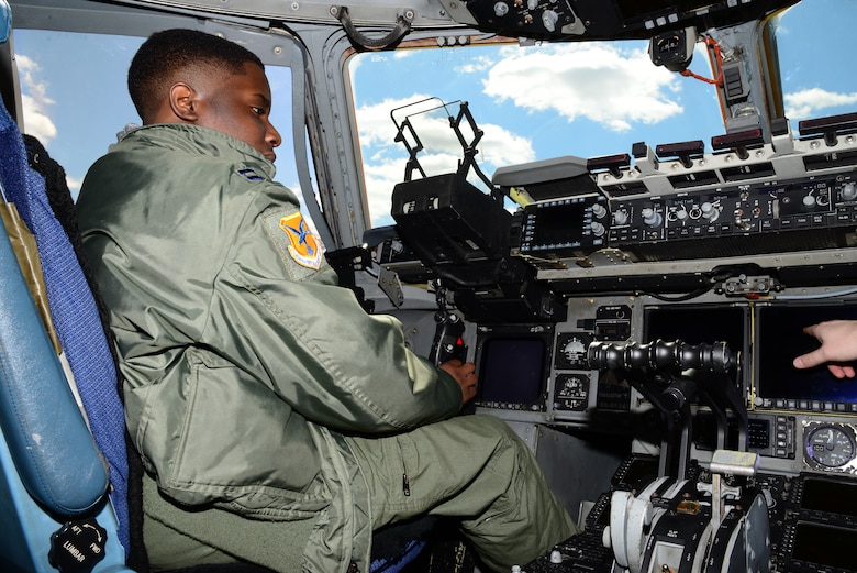 Kareem Bennett explores the cockpit of a C-17 Globemaster III March 16, 2018, at Dover Air Force Base, Del. Bennett and his family were invited to the installation for a private, day-long tour by the 3rd Airlift Squadron. (U.S. Air Force photo by Staff Sgt. Aaron J. Jenne)