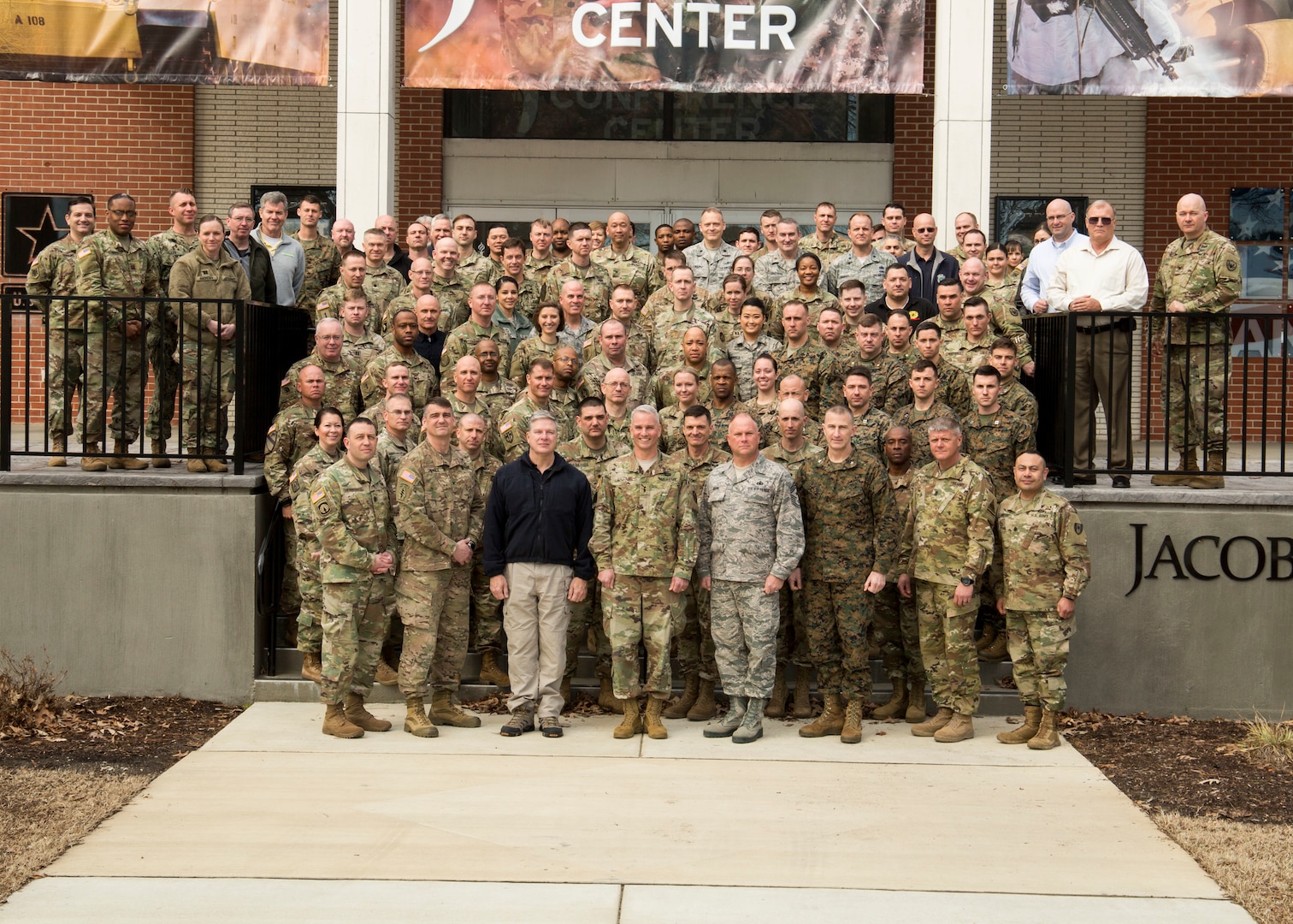 FORT EUSTIS, Va. -- Attendees of the Defense Chemical, Biological, Radiological and Nuclear Response (DCRF) Commanders Conference pose for a group photo outside the Jacob's Conference Center at Fort Langley Eustis, Va. March 8, 2018. The three-day conference allowed Joint Task Force Civil Support (JTF-CS) and DCRF leadership to review how thousands of military service members would respond to a catastrophic disaster in the U.S, whether manmade or natural.  JTF-CS provides command and control for designated Department of Defense specialized response forces to assist local, state, federal and tribal partners in saving lives, preventing further injury, and providing critical support to enable community recovery.