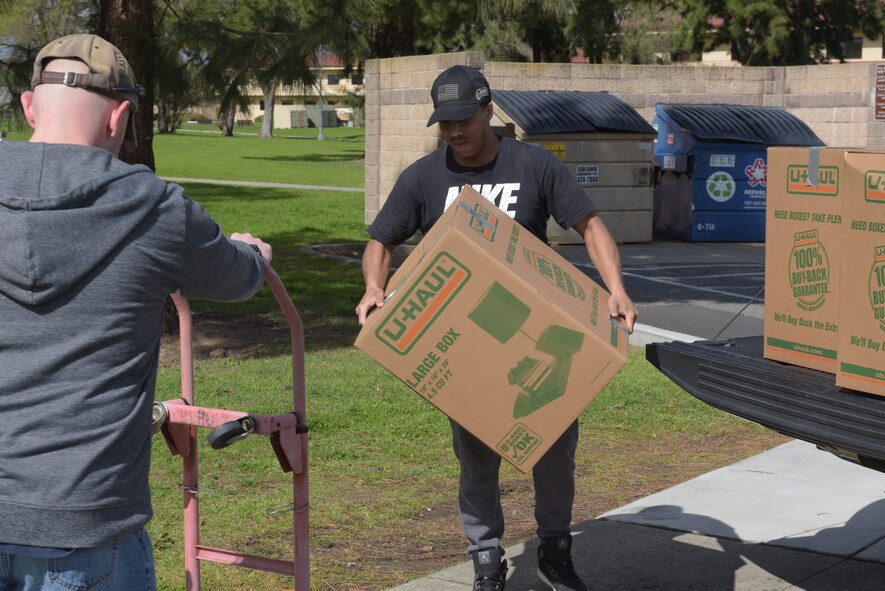 Tech. Sgt. Tony Jones, 60th Comptroller Squadron, removes a box of jackets from his truck outside the Airmen’s Attic at Travis Air Force Base, Calif., March 17, 2018. The jackets were donated by Marina Cassimus of San Rafael, Calif., a widow of an Air Force veteran. Jones volunteered to make the 94-mile trip to San Rafael and back to Travis to deliver the jackets. (U.S. Air Force photo/Tech. Sgt. James Hodgman)