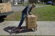 Master Sgt. Philip Waite, 60th Aircraft Maintenance Squadron, places a box of jackets onto a dolly outside the Airmen’s Attic at Travis Air Force Base, Calif., March 17, 2018. The jackets were donated by Marina Cassimus of San Rafael, Calif., a widow of an Air Force veteran. (U.S. Air Force photo/Tech. Sgt. James Hodgman)