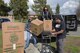 Master Sgt. Philip Waite(Left), 60th Aircraft Maintenance Squadron (Left), Master Sgt. Valerie Jones (Center), Air Force Legal Operations Agency and Tech. Sgt. Tony Jones (Right), 60th Comptroller Squadron, remove boxes of jackets, books and other supplies from a truck outside the Airmen’s Attic at Travis Air Force Base, Calif., March 17, 2018. The items were donated by Marina Cassimus of San Rafael, Calif., the widow of an Air Force veteran. (U.S. Air Force photo/Tech. Sgt. James Hodgman)
