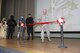 Col. George Tromba, 412th Mission Support commander, cut the ceremonial ribbon to officially reopen the base theater as members of the 501st Legion looked on March 16. (Courtesy photo by Kayla Fagan)
