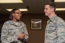 First Lt. Anthony Angell, 375th Air Mobility Wing assistant chaplain, right, visits Airmen from the 375th Force Support Squadron March 5, 2018, at the Military Personnel Section, Scott Air Force Base, Ill. A chaplain’s mission is to provide spiritual care and the opportunity for Airmen, their families, and other authorized personnel to exercise their constitutional right to the free exercise of religion. (U.S. Air Force photo by Senior Airman Melissa Estevez)