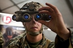 A U.S. Marine poses with a drone during Urban Advanced Naval Technology Exercise 2018 at Camp Pendleton, Calif.