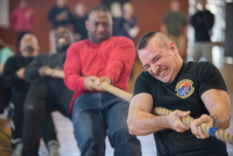 U.S. Air Force Chief Master Sgt. Jay Birtch III, 35th Logistic Readiness Squadron chief enlisted manager, grimaces while pulling a rope during the 16th Annual Northern Air Defense Force Commander’s Cup Tug of War Tournament at the Japan Air Self-Defense Force (JASDF) gymnasium at Misawa Air Base, Japan, March 18, 2018. This tug of war event showcased the partnership and friendship between JASDF, U.S. Air Force, and U.S. Navy personnel. There were 19 teams, consisting of three Navy, five Air Force, and 11 JASDF teams who competed for the tug of war championship title. (U.S. Air Force photo by Senior Airman Brittany A. Chase)