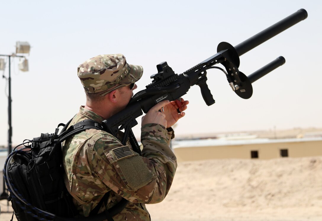 First Security Forces Assistance Brigade Soldier uses Drone Defender with electromagnetic pulse to disable, capture, and control target drone, Camp Buehring, Kuwait, March 6, 2018 (U.S. Army/Brent Thacker)