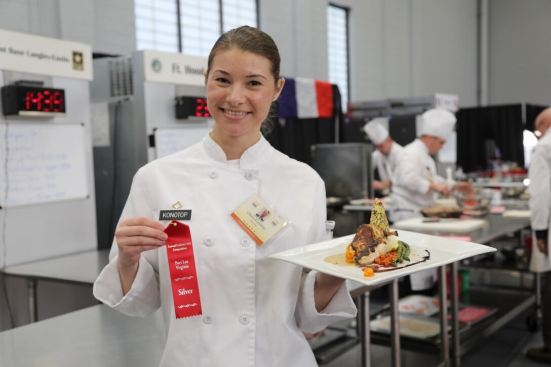 An Army chef holds a second-place ribbon and her winning dish.