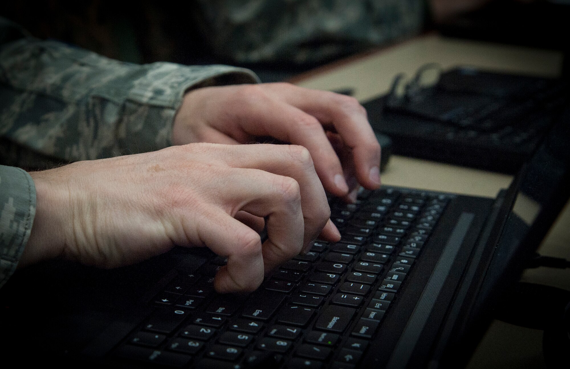 An Airman types on his computer during the Cybersecurity Foundry Course at MacDill Air Force Base, Fla., March 9, 2018. Course instructors taught 100 cyberspace students various cybersecurity functions, processes, procedures and data analysis skills to further their ability to secure the Air Force Network. (U.S. Air Force photo by Senior Airman Mariette Adams)