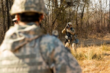 U.S. Army Reserve Spc. Torrance Saunders, a combat documentation/ production specialist with the 982nd Combat Camera Company (Airborne) maneuvers to photograph Soldiers during a react to contact battle drill during Combat Support Training Exercise (CSTX) at Fort Knox, Kentucky, March 15, 2018.