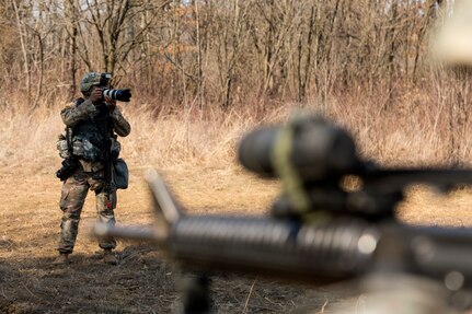 U.S. Army Reserve Spc. Torrance Saunders, a combat documentation/ production specialist with the 982nd Combat Camera Company (Airborne) maneuvers to photograph Soldiers during a react to contact battle drill during Combat Support Training Exercise (CSTX) at Fort Knox, Kentucky, March 15, 2018.