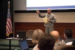 Col. Gregory Davis, 690th Cyberspace Operations Group commander, gives closing remarks at the inaugural Cybersecurity Foundry Course at MacDill Air Force Base, Fla., March 14, 2018. Course instructors taught 100 cyberspace students various cybersecurity functions, processes, procedures and data analysis skills to further their ability to secure the Air Force Network. (U.S. Air Force photo by Airman 1st Class Scott Warner)
