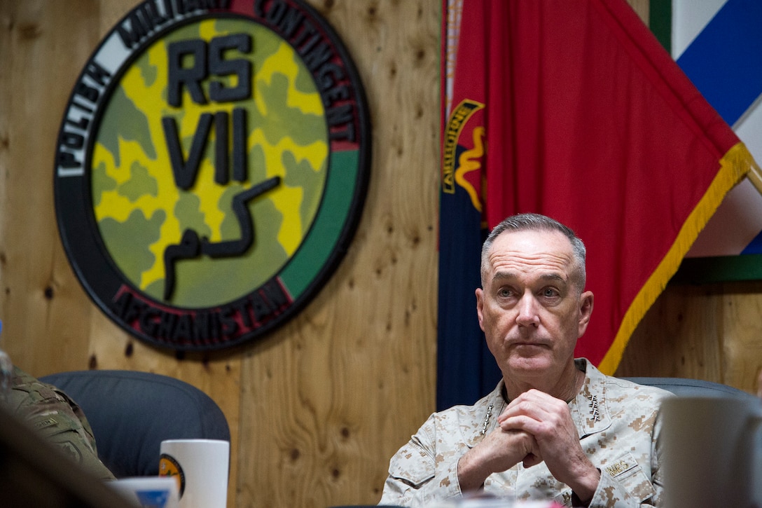 Marine Corps Gen. Joe Dunford, chairman of the Joint Chiefs of Staff, sits at a table.