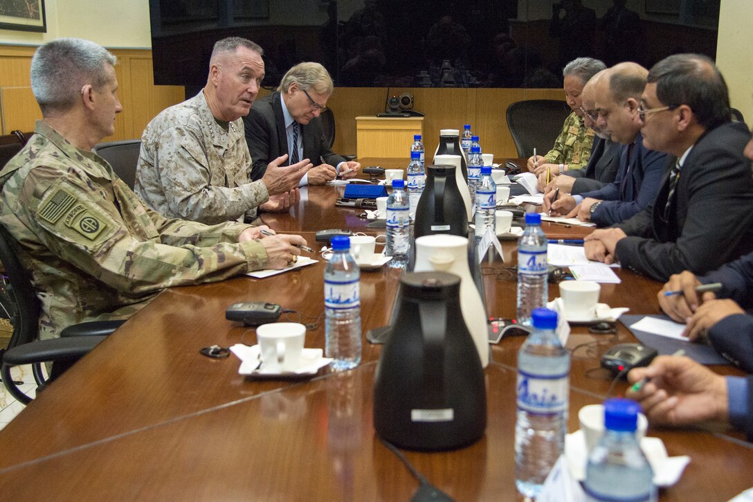 U.S. military leaders meet with Afghan leaders around a table in Kabul, Afghanistan.