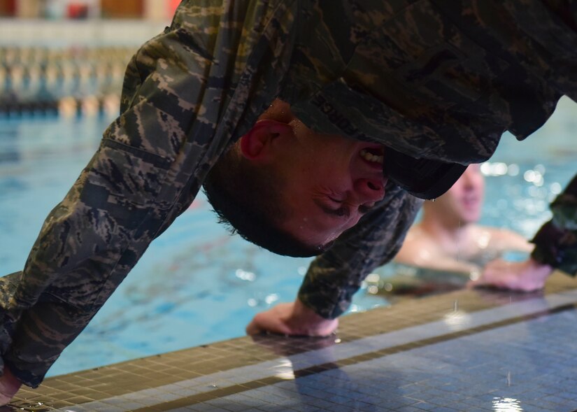 .S. Air Force SSgt. Dajon Begin, 45th Intelligence Squadron full motion video imagery mission supervisor, takes a break from doing push-ups in Fort Eustis’ Anderson Field House at Joint Base Langley-Eustis, Virginia, March 6, 2018.