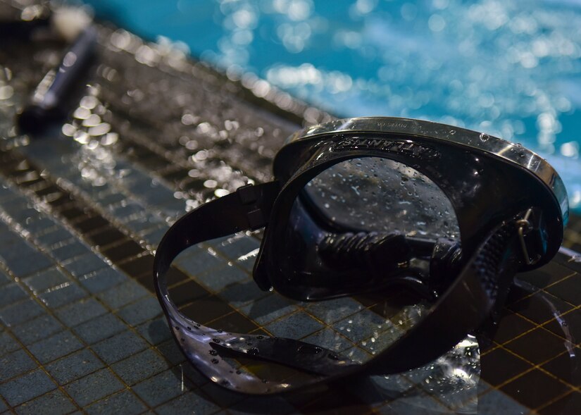 A water confidence course trainee leaves his goggles poolside at  Fort Eustis’ Anderson Field House at Joint Base Langley-Eustis, Virginia, March 6, 2018.