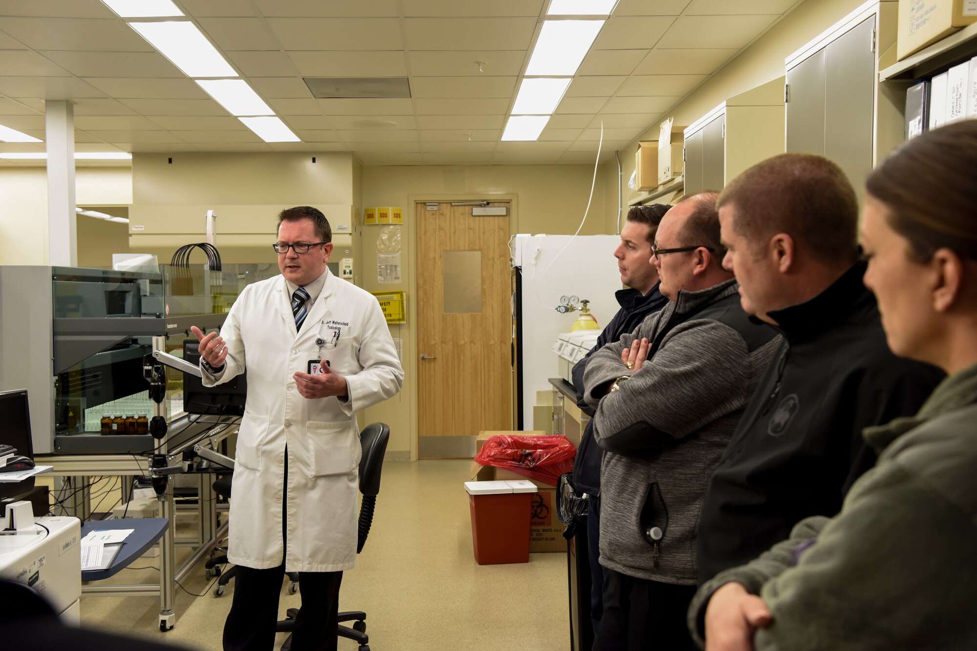 Dr. Jeffrey Walterscheid, Armed Forces Medical Examiner System Division of Forensic Toxicology chief toxicologist, shows Team Dover’s honorary commanders the labs of AFMES during their tour March 14, 2018, at Dover Air Force Base, Del.  The honorary commanders are key leaders of the Dover community selected to help foster professional relationships between the base and surrounding community. (U.S. Air Force photo by Airman 1st Class Zoe M. Wockenfuss)
