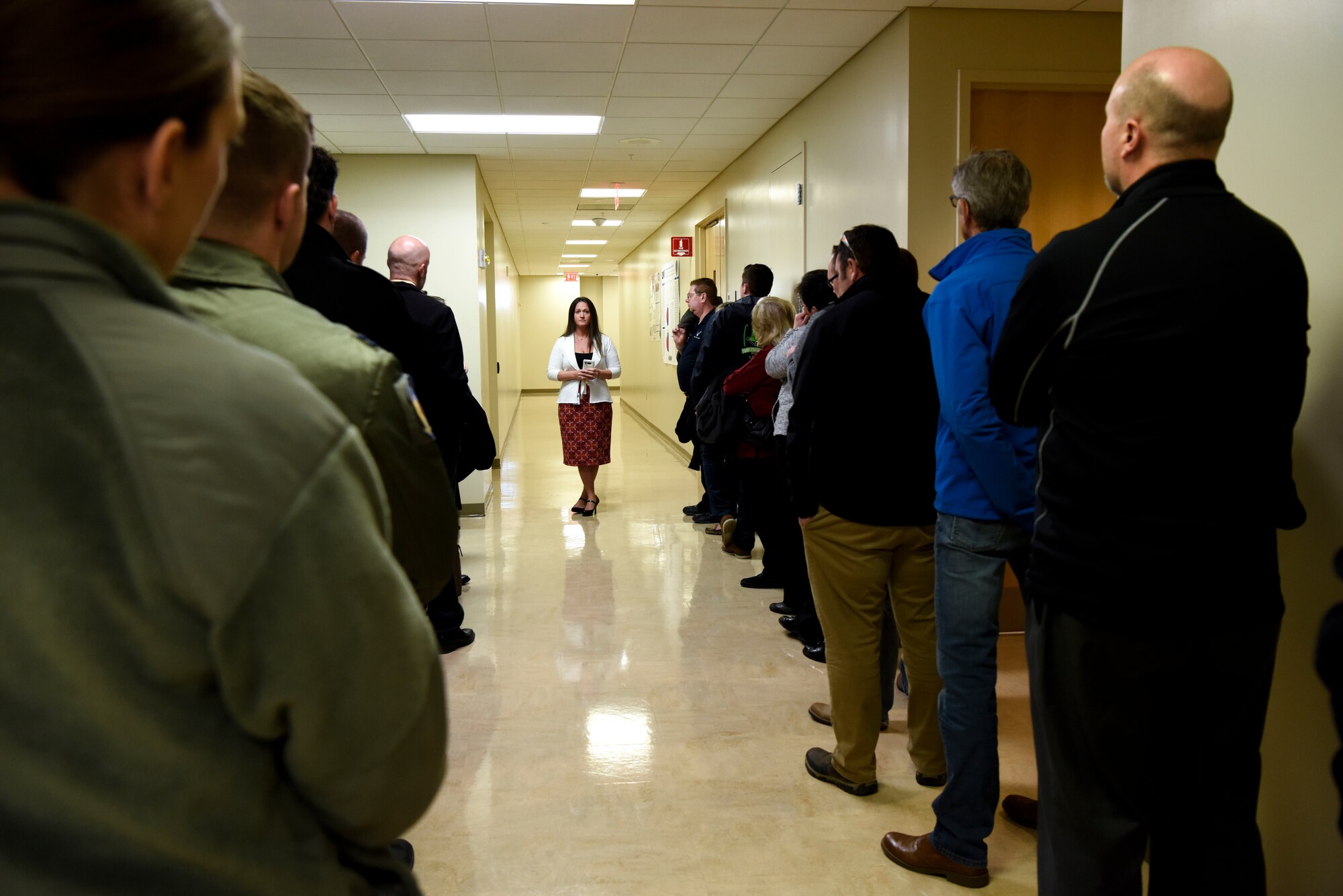 Jennifer Vallee, Armed Forces Medical Examiner System public affairs officer, leads a tour of Team Dover’s honorary commanders through AFMES March 14, 2018, at Dover Air Force Base, Del. The group toured AFMES, Air Force Mortuary Affairs Operations, Joint Personal Effects Depot, the Dover Fisher House and the Center for the Families of the Fallen. (U.S. Air Force photo by Airman 1st Class Zoe M. Wockenfuss)