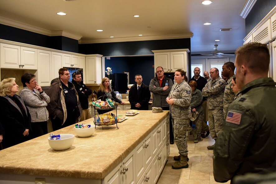 Tech. Sgt. Dorothy Whitfield, NCO in charge of the Dover Fisher House, shows Team Dover’s honorary commanders the Fisher House March 14, 2018, at Dover Air Force Base, Del. Honorary commanders experience all aspects of the base and its daily operations during their year in the position. (U.S. Air Force photo by Airman 1st Class Zoe M. Wockenfuss)