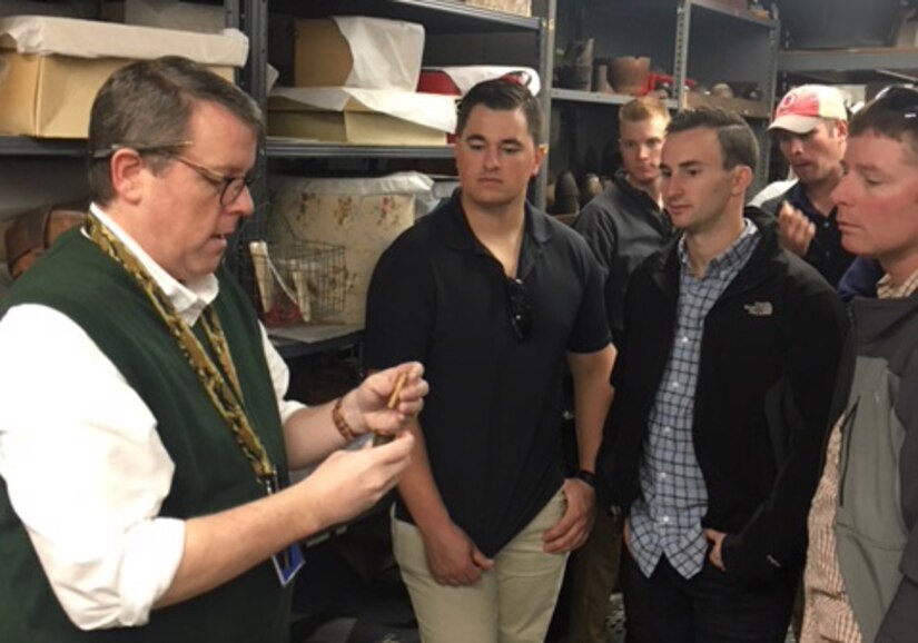 Graham Long, left, Charleston Museum, head curator, explains Civil War fuses to the 628th ABW Explosive Ordnance Disposal flight.