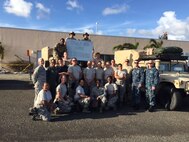 Members of a U.S. Air Force En Route Patient Staging System team, made up of Airmen from the 375th Medical Group from Scott Air Force Base and members of U.S. Transportation Command, pose for a photo on Oct. 4, 2017, at the end of a deployment following Hurricane Maria in St. Croix, U.S. Virgin Islands. (Photo by Lt. Col. Elizabeth Anderson-Doze)