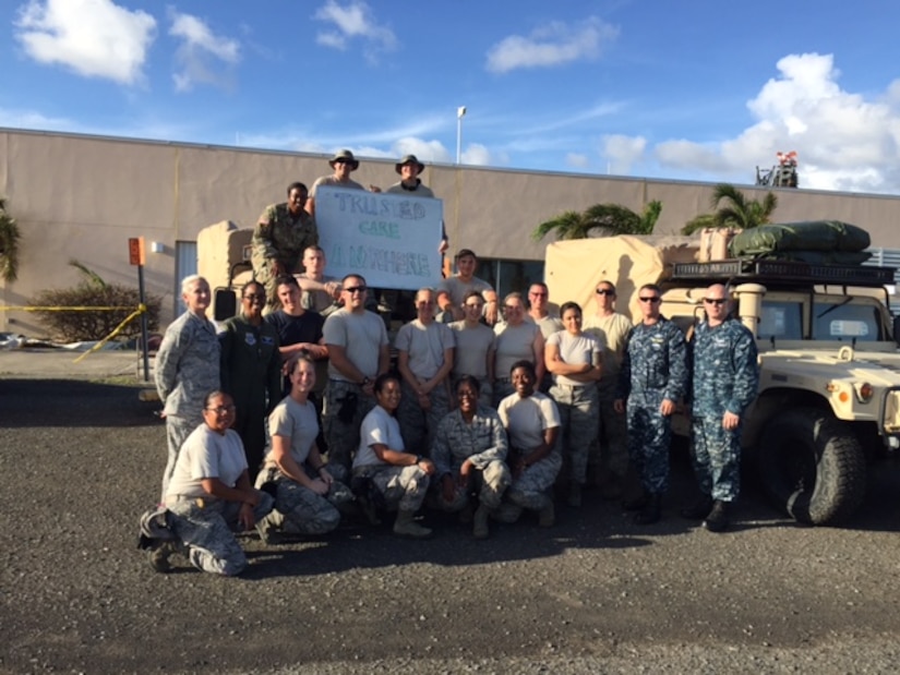 Members of a U.S. Air Force En Route Patient Staging System team, made up of Airmen from the 375th Medical Group from Scott Air Force Base and members of U.S. Transportation Command, pose for a photo on Oct. 4, 2017, at the end of a deployment following Hurricane Maria in St. Croix, U.S. Virgin Islands. (Photo by Lt. Col. Elizabeth Anderson-Doze)