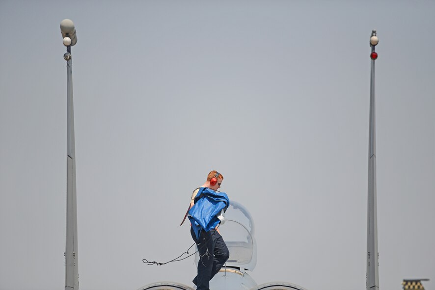 U.S. Air Force Senior Airman Tyler Moreland, an electrical and environmental systems journeyman assigned to the 18th Component Maintenance Squadron, Kadena Air Base, Japan, secures an F-15C Eagle from the 44th Fighter Squadron, Kadena AB, during COPE TIGER 2018 from Korat Air Base, Thailand, March 20, 2018.