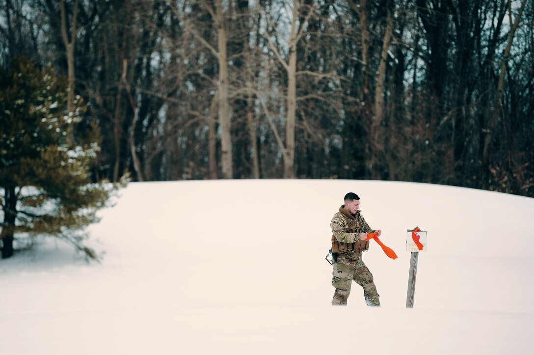 A soldier marks the landing zone.