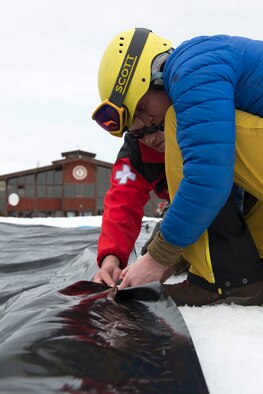 Hillberg Ski Area personnel prepare the pit area for the 2018 Slush Cup at Joint Base Elmendorf-Richardson’s Hillberg Ski Area, March 18, 2018. The Slush Cup is a two-fold annual event celebrating the change in weather, consisting of skiers and snowboarders trying to make it across a man-made slush pond without falling.