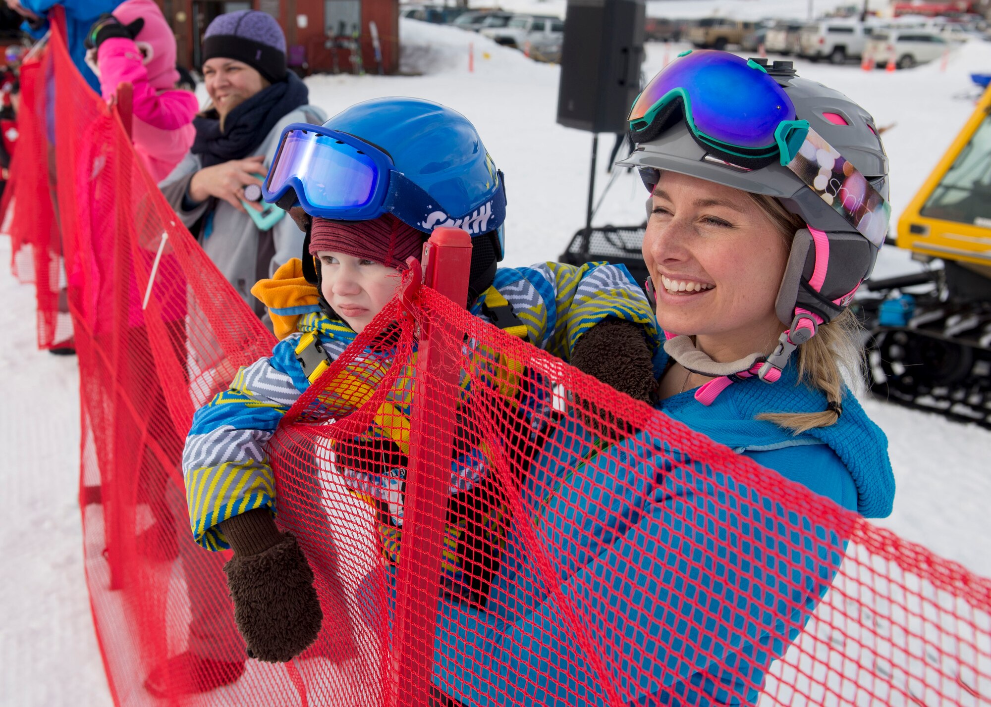 Personnel and families take part in the 2018 Slush Cup at the Joint Base Elmendorf-Richardson Hillberg Ski Area, March 18, 2018. The Slush Cup is a two-fold annual event celebrating the change in weather, consisting of skiers and snowboarders trying to make it across a man-made slush pond without falling.