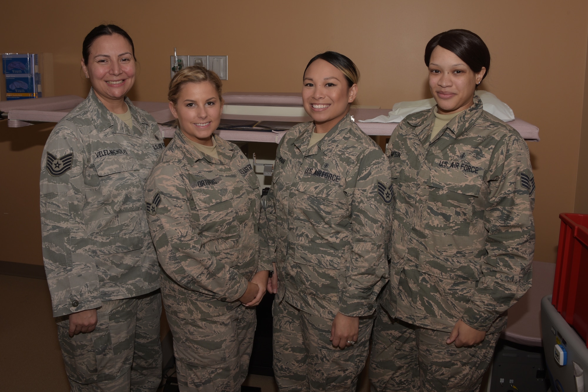 Staff Sgt. Cherielyn Amaba and Staff Sgt. Porcha Simpson, all members of the Mammography Clinic at David Grant USAF Medical Center, post for a photo March 1, 2018.  (U.S. Air Force photo/Tech. Sgt. James Hodgman)