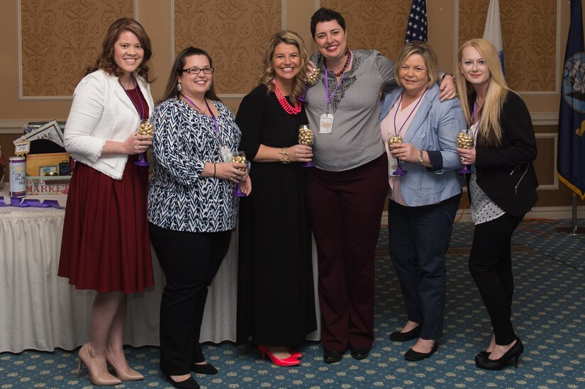 A group of military spouses of the year pose for a photo during the Joint Service Luncheon at Joint Base Langley Eustis, Va., March 15, 2018.