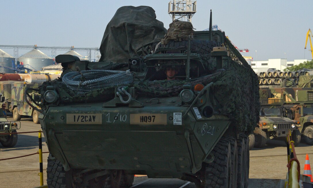 A US Army M1126 Stryker pulls onto a transport ship