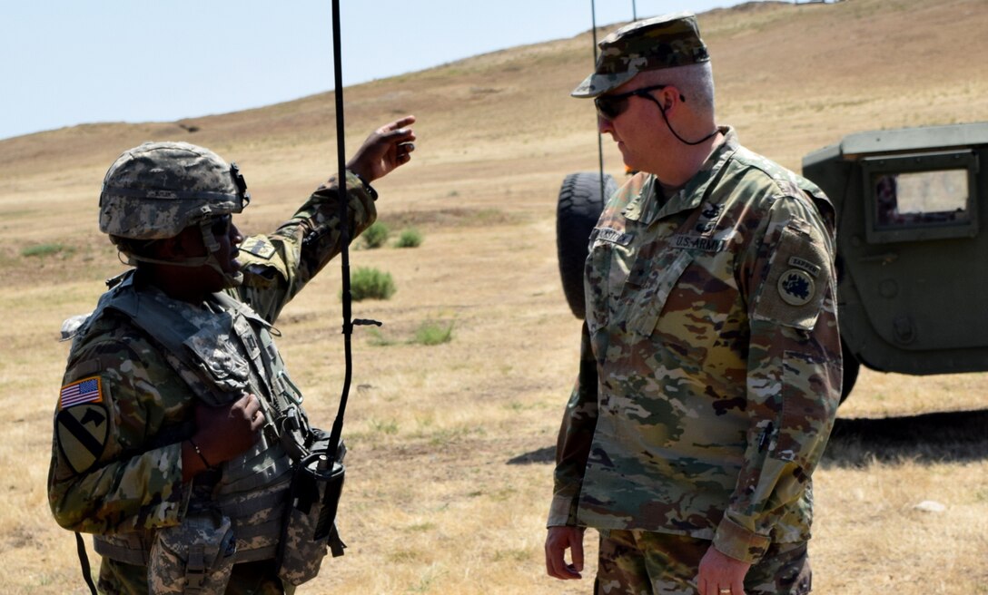 Captain Christopher Butler, commander of the Georgia Army National Guard’s 810th Engineer Company orients Brig. Gen. Thomas Blackstock, commander of the 78th Troop Command