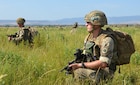 British soldiers pull security at a collection point after jumping into the drop zone