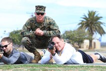 Staff Sgt. Ryan Kraus, a recruiter with Recruiting Station Indianapolis, assists educators with rifle handling basics on Marine Corps Base Camp Pendleton, Calif., during the RS Indianapolis and RS St. Louis Educator Workshop, March 5-9. Educators and key influencers from across all parts of Indiana and Illinois attended the Marine Corps Recruiting Command’s Educator Workshop aboard Marine Corps Recruit Depot to better understand the transformation process in becoming a United States Marine. The workshop demonstrated to teachers, coaches and other student influencers how the Marine Corps makes Marines, wins our nation’s battles, and develops quality citizens.