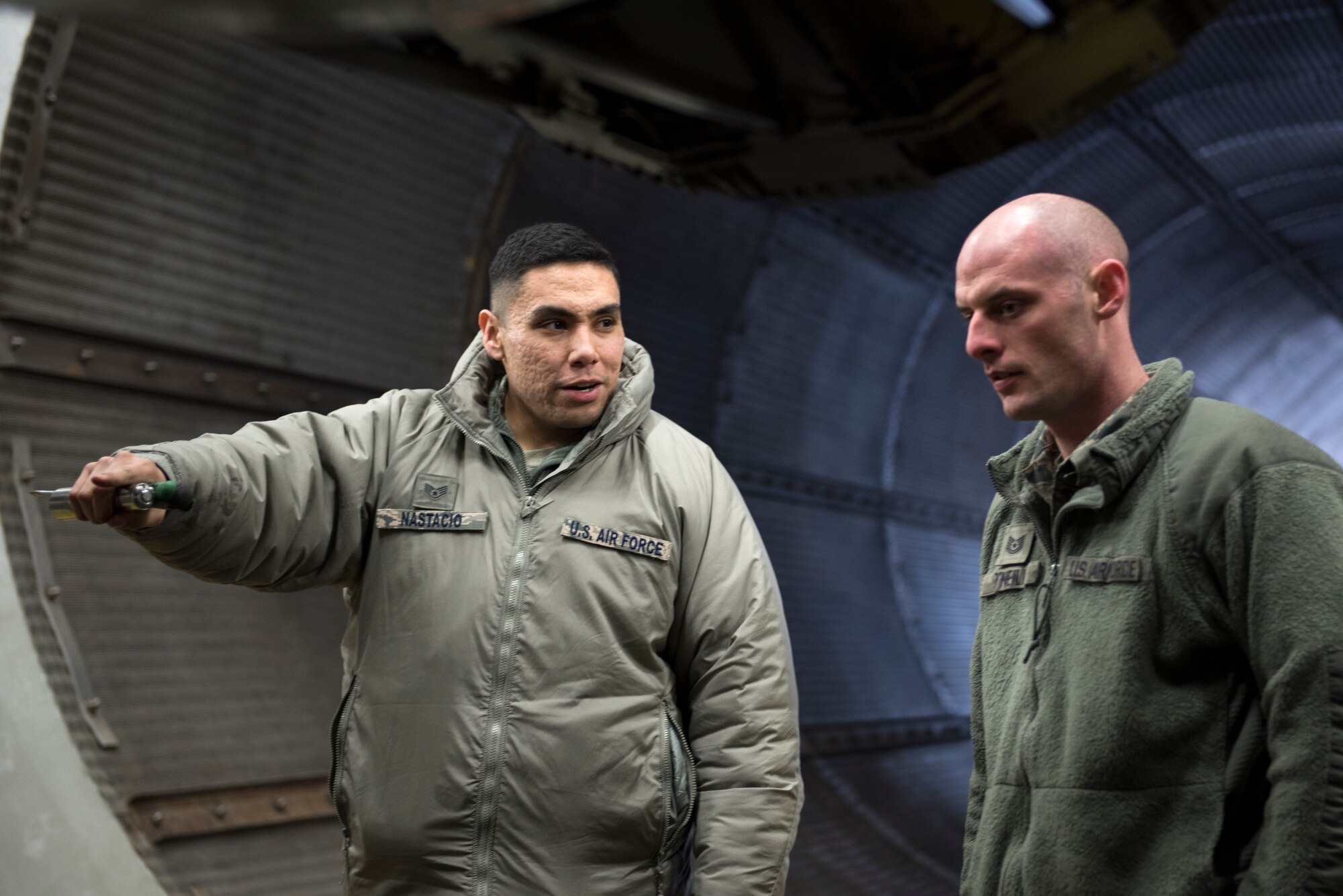 A 48th Maintenance Group training instructor teaches a maintainer how to secure an aircraft in the hush house prior to an engine run test at Royal Air Force Lakenheath, England, Mar. 8. Maintenance instructors manage almost two dozen course requirements and average 390 classes each year. (U.S. Air Force photo/Senior Airman Malcolm Mayfield)
