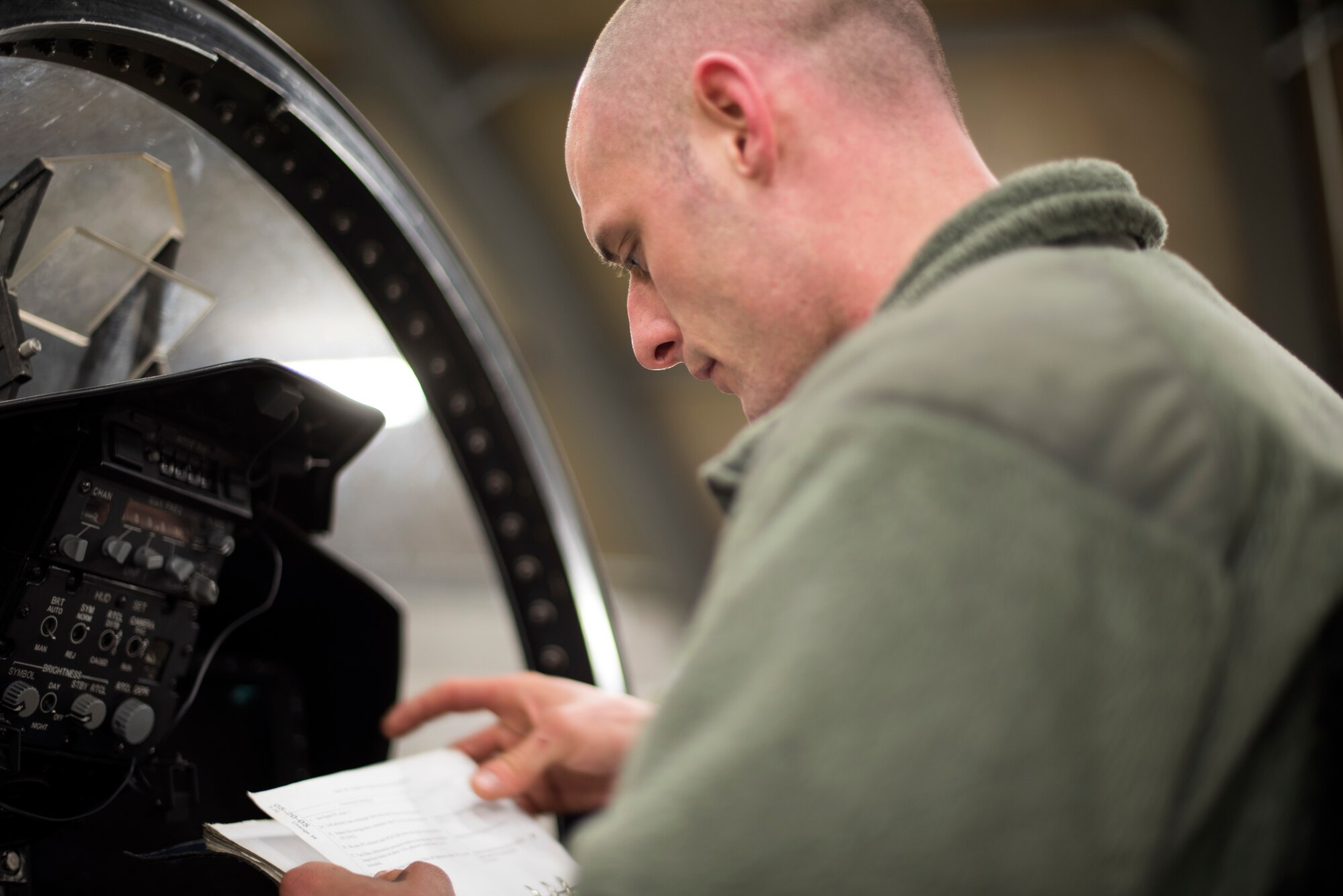 A 48th Maintenance Group Airman reviews instructions to safely conduct an engine run test at Royal Air Force Lakenheath, England, Mar. 8. Maintainers are required to memorize engine run test instructions prior to their written exam. (U.S. Air Force photo/Senior Airman Malcolm Mayfield)