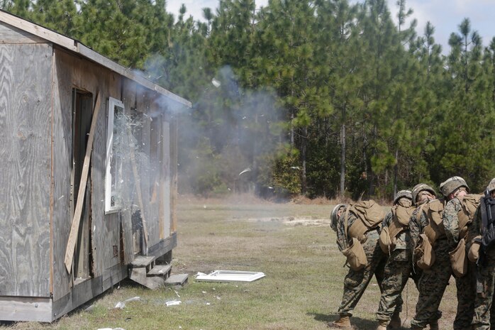 U.S. Marines from different units detonate a window charge during an Urban Breaching range at Camp Lejeune, N.C., March 20, 2018. Marines performed urban breaching exercises to gain hands-on experience in conducting tactical maneuvers, as well as proper handling and making of explosive charges. The Marines are with 2nd Combat Engineer Battalion and 3rd Battalion, 6th Marine Regiment, 2nd Marine Division.