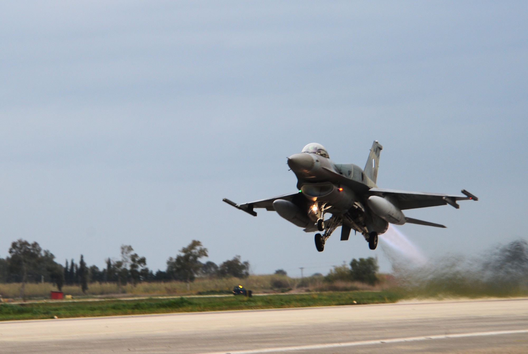 An F-16 Fighting Falcon assigned to the Hellenic Air Forces’ 336th Squadron takes off from Andravida Air Base, Greece, March 21, 2018, during exercise INIOHOS 18. The 336th Squadron are training with the 492nd Fighter Squadron, Royal Air Force Lakenheath, England and other partners and Allies during the exercise to increase interoperability and strengthen partnerships. (U.S. Air Force photo/1st Lt. Elias Small)