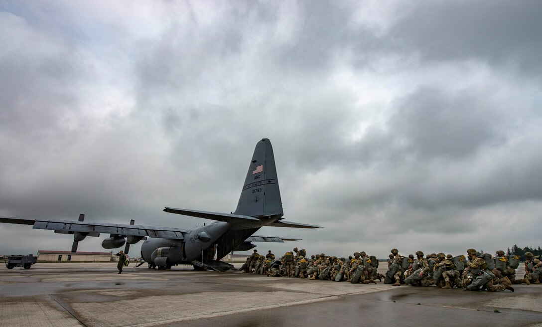 U.S. and Czech army paratroopers, board a C-130H Hercules