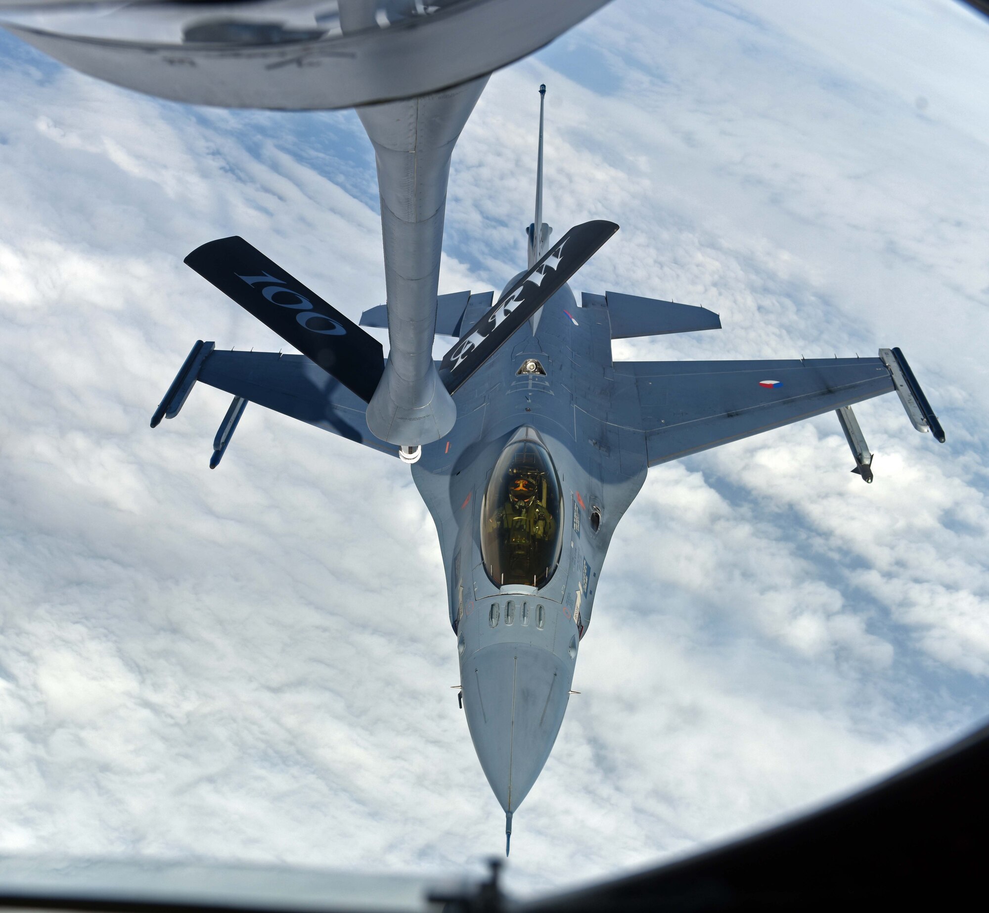 A Royal Netherlands Air Force F-16 prepares to receive fuel from a U.S. Air Force KC-135 Stratotanker during an aerial refueling training mission March 21, 2018, over the Netherlands. The F-16 flew in a formation with U.S. Air Force F-15C Eagles from the 142nd Fighter Wing, Portland, Oregon, operating from Leeuwarden Air Base, Netherlands, as part of a Theater Security Package in support of Operation Atlantic Resolve. (U.S. Air Force photo by Senior Airman Luke Milano)