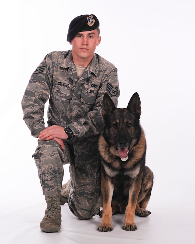 Staff Sgt. Steven Watkins, 366th Security Forces military working dog trainer, and Military Working Dog Onyx pose for a portrait together. The duo has worked together for the past three years.