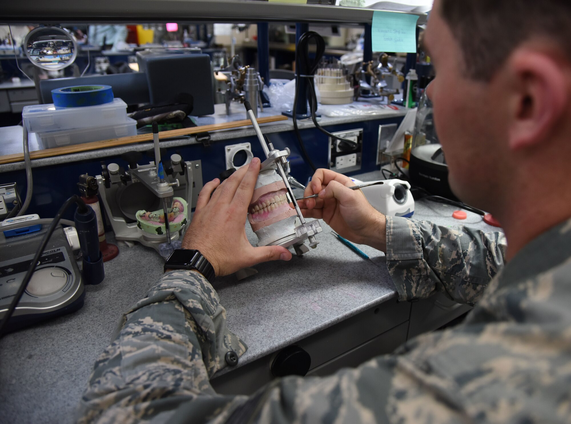 U.S. Air Force Staff Sgt. Sean Campbell, 81st Dental Squadron dental technician, works in the new dental clinic during the Keesler Medical Center renovations ribbon cutting ceremony March 20, 2018, on Keesler Air Force Base, Mississippi. The ceremony officially commemorated the completion of the $80 million renovations for the new dental and mental health clinics. The new renovations allow for improved patient support services. (U.S. Air Force photo by Kemberly Groue)